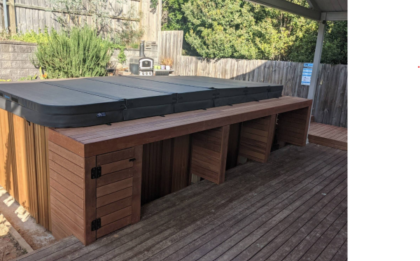 Spa in backyard with bench